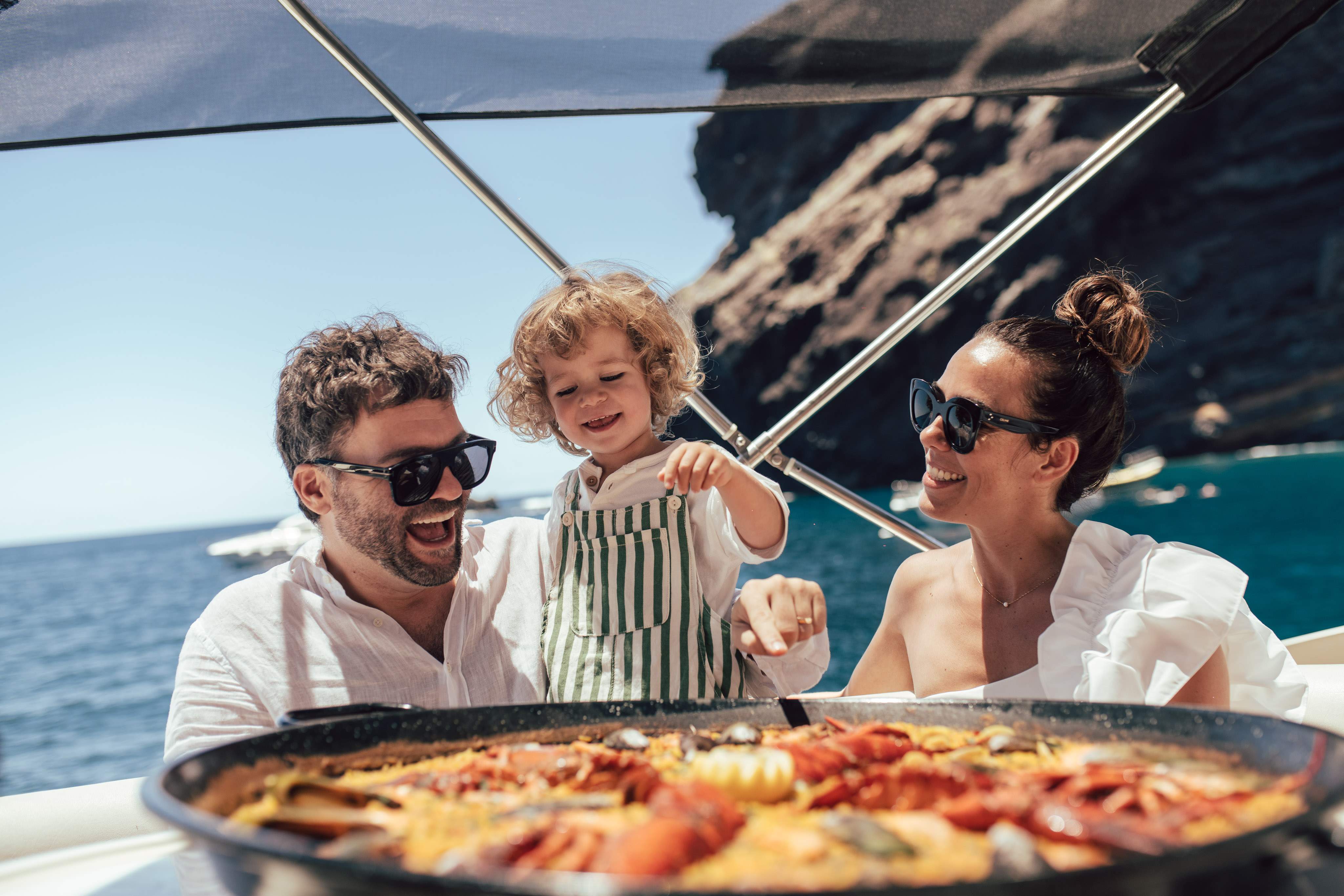 Family eating Paella on Luxury Yacht Charter in Costa Adeje with Astondoa 46